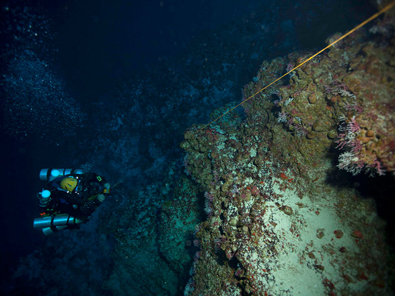 Brian Kakuk reeling back to starting point from depth. A reel was used to lead the deep diving team back to the mooring line.