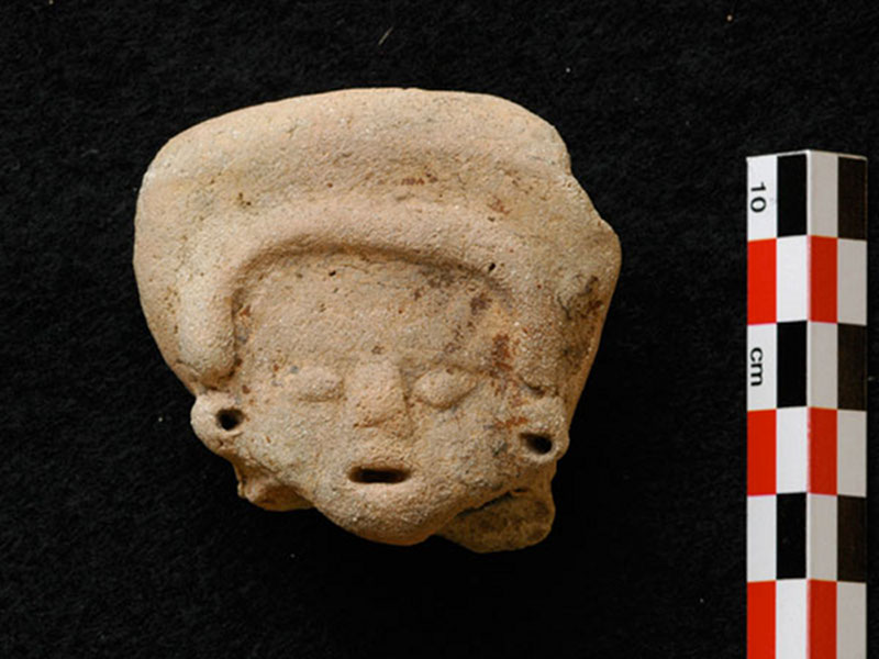 A fragment of a Middle Preclassic figurine that was recovered in 2008.