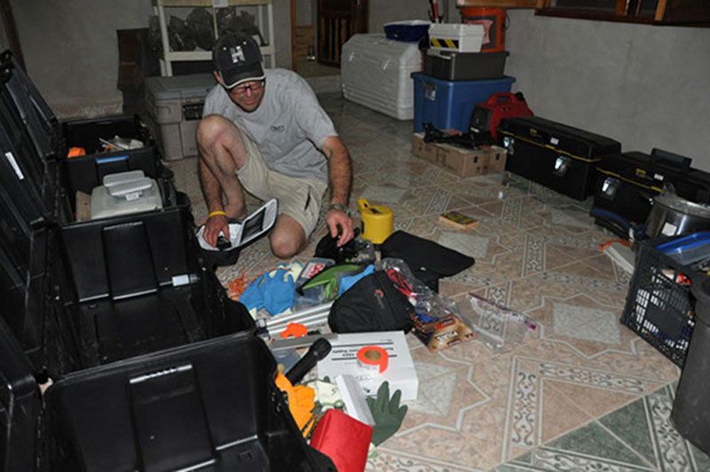 At the team’s base of operations in Kantunilkin, Dominique sorts, labels and prepares to pack gear before heading out to Vista Alegre.