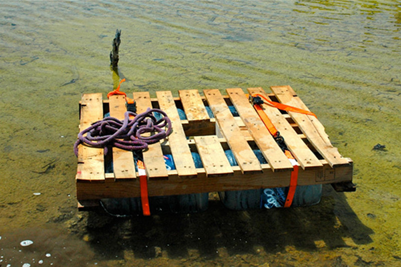 To avoid dragging the initial coring platform and dingys through thick mangroves and knee-deep mud, a secondary portable coring platform was constructed using four empty 10-gallon water bottles, a wooden pallet and a few ratchet straps.