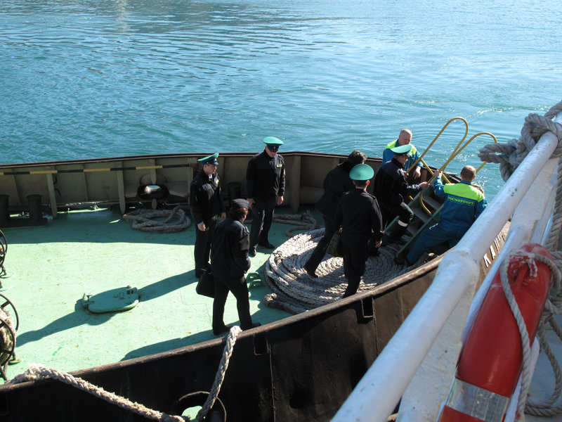 Customs and immigration officials inspect the the Russian research vessel Professor Khromov.