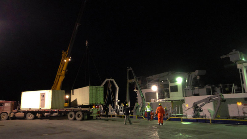 Progress at last: The first of the two 20-foot container vans that left Woods Hole Oceanographic Institution in mid-February is offloaded alongside the R/V Melville in Punta Arenas’ Mardones dock.
