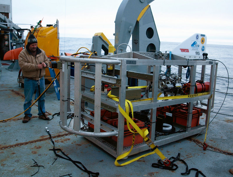 TowCam engineer John making similar final preparations for TowCam. As soon as Sentry is overboard tonight, TowCam will follow fast behind, surveying a different part of the seabed and sending images straight back to the operators aboard ship while Sentry stores its photos onboard its own computers to await return to the ocean surface on Friday.