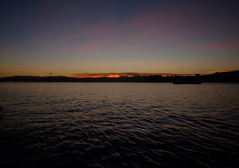 Dawn backlights the Andes as we slip quietly into port at first light.