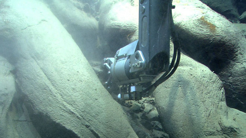 Quest 4000 ROV collects a rock sample among pillow lava at Mata Ua.