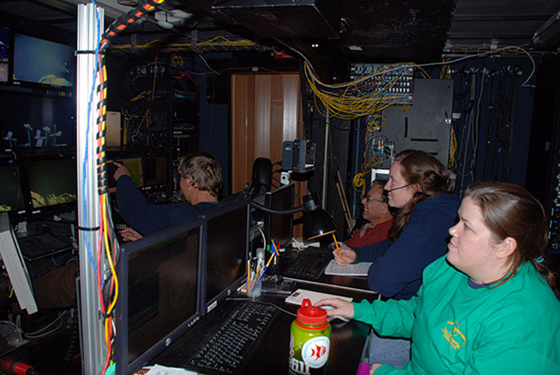 Graduate students Esprit Saucier, Alanna Casey, and NOAA Office of Ocean Exploration and Research archaeologist Frank Cantelas work with ROV Jason team