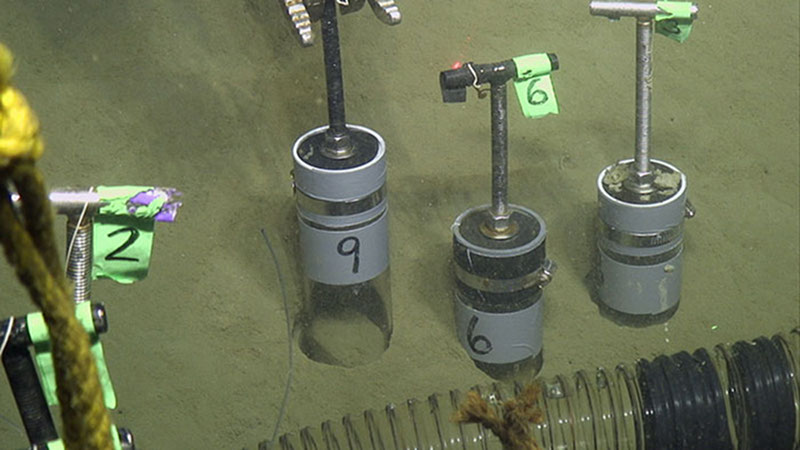 Jason inserts push cores into the muddy bottom with one of its manipulator arms.