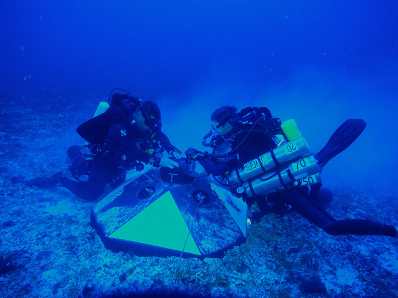 The University of Miami’s technical dive team installing sensors on a mooring buoy.