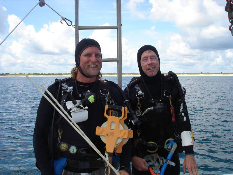 Chuck Meide, left, and Sam Turner, right, prepare to enter the water for the first dive of the project.