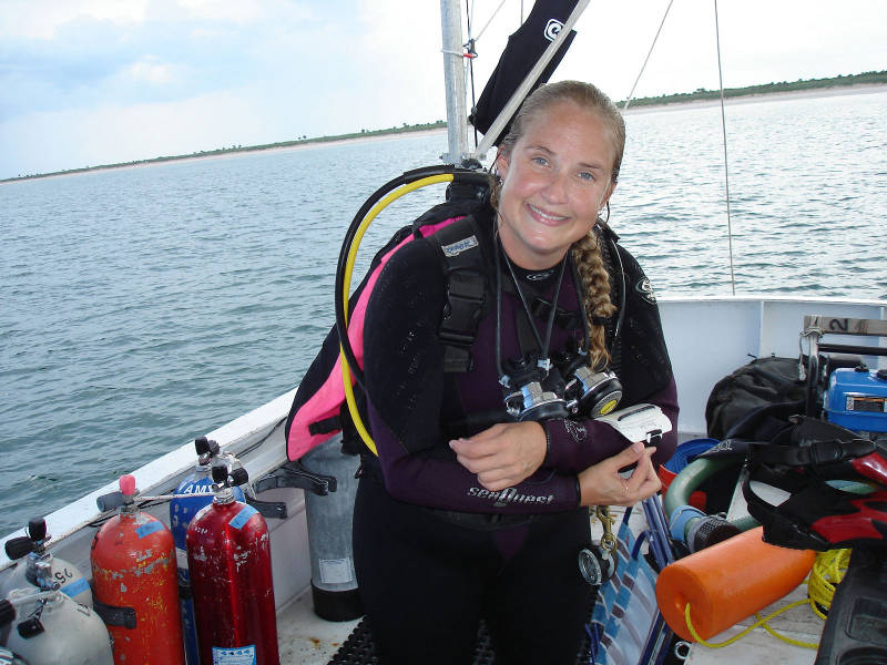 Starr Cox preparing for her first dive. The mission: to probe a series of holes along an east-west line on the bottom, in hopes of finding the source of the magnetism at Target E3T.