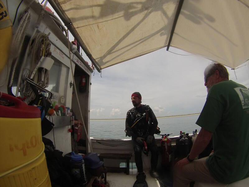 Brian McNamara prepares for a dive, while at right John Stiner looks on. Brian participated on the first two cruises and decided to join us for one more day of diving, while John has come out as an observer and representative of the Canaveral National Seashore.