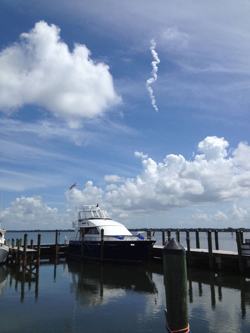 The exhaust trail of a Falcon 9 rocket launched from Kennedy Space Center, visible from Roper at dock.