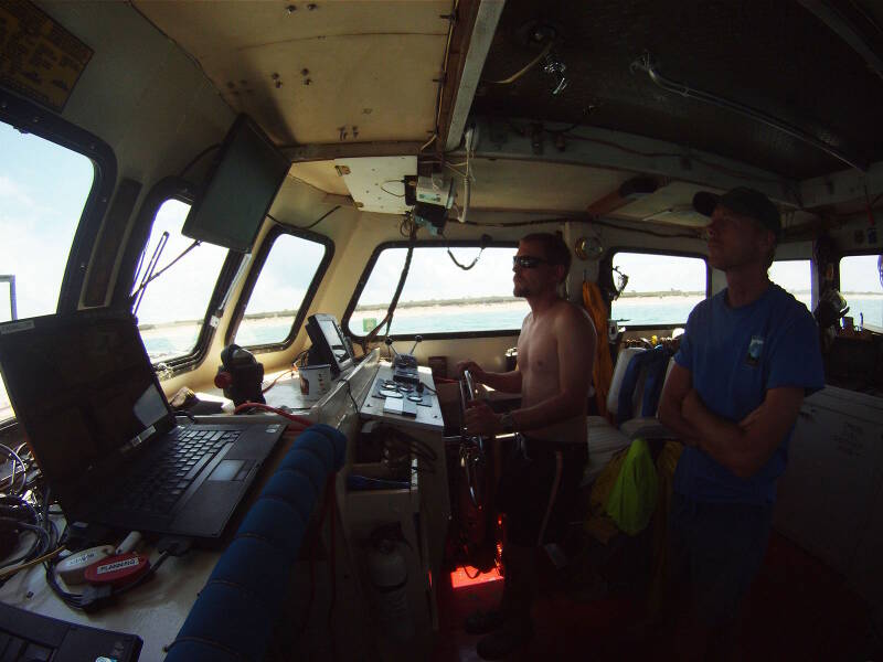 Captain Brendan Burke pilots the Roper along a survey lane while Dr. Sam Turner monitors the magnetometer display.
