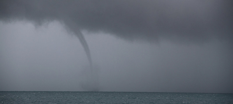A water spout formed in the distance over Rebecca Shoal. Water spouts are essentially tornadoes at sea, but are less powerful than their terrestrial counterparts.