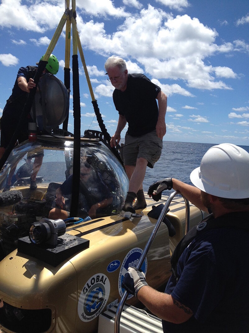 Mike Ruane, Washington Post staff writer, enters the manned submersible.