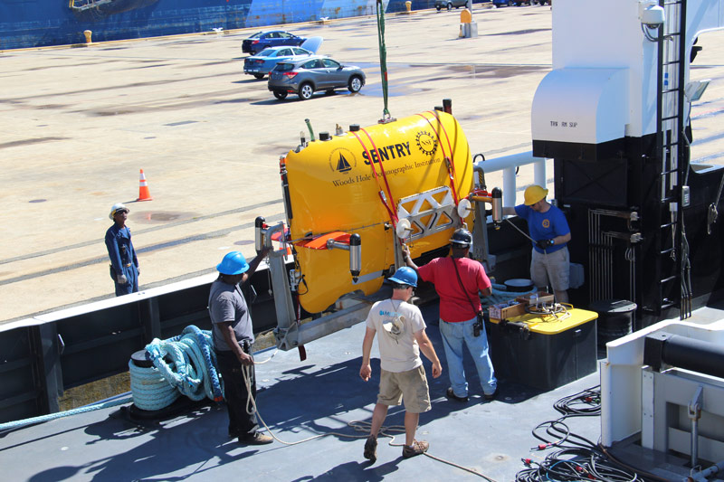 The AUV team and crew load Sentry on to NOAA Ship Pisces.