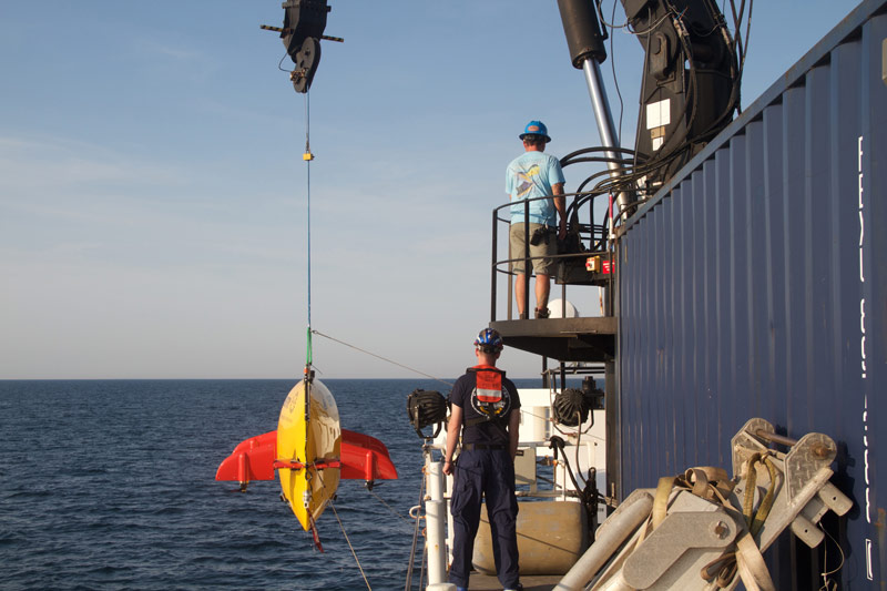 Autonomous underwater vehicle Sentry is lowered over the side of NOAA Ship Pisces.