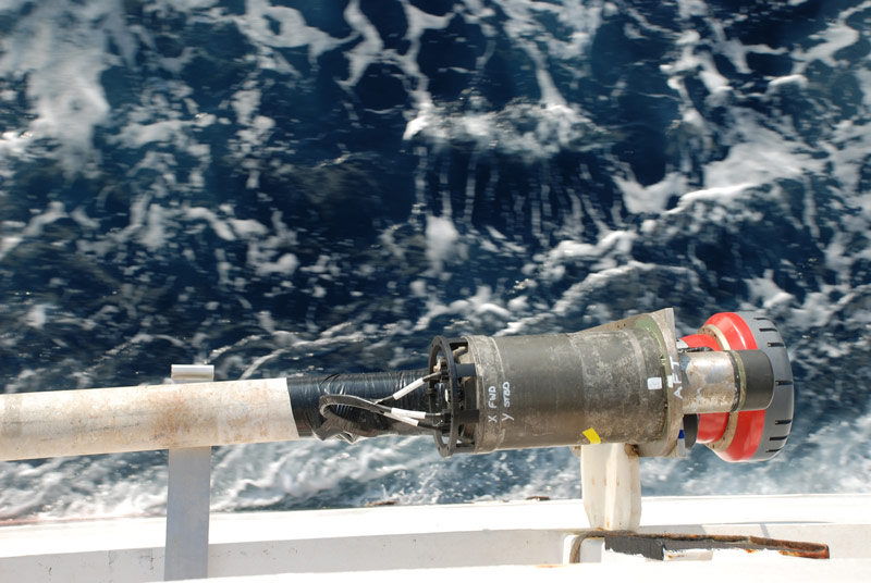 A close-up look at the transceiver (red cylinder) and the fiber optic gyro (large grey cylinder).