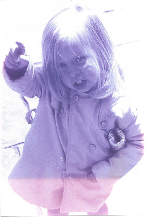 When she was two, Amanda’s family traveled to Newcastle England. Here she is holding the rolled up brass-rubbing that they had completed.