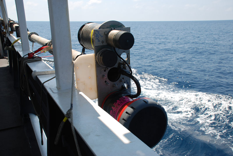 The transceiver on the end of the pole. While underway, the transceiver is secured to the side of the ship (as pictured). The transceiver is lowered into the water when used to send signals to Sentry.