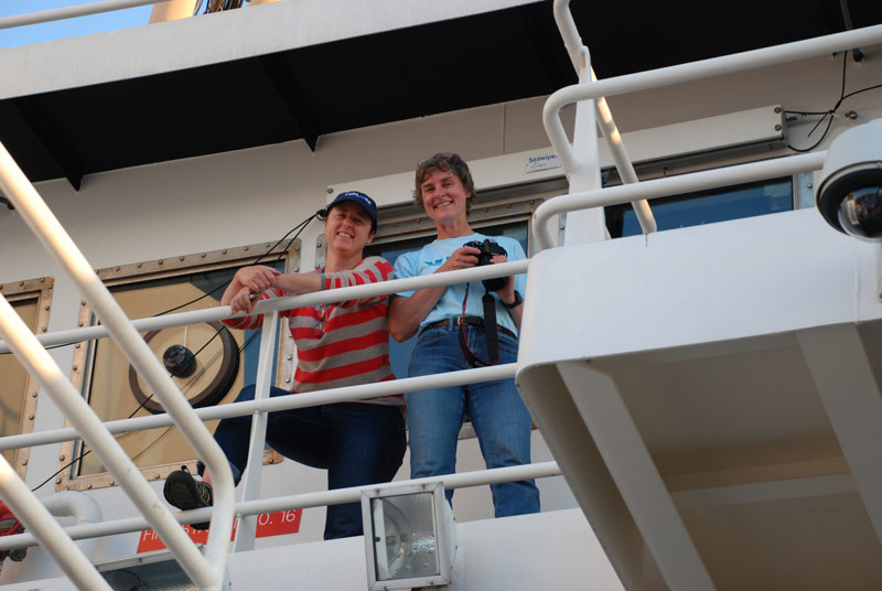 Liz Shea (left) and Martha Nizinski watch a Sentry deployment from NOAA Ship Pisces.