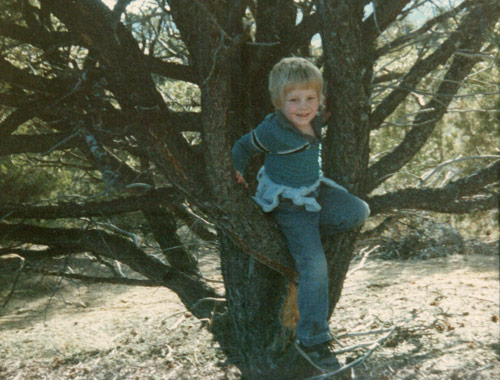 Carl climbing a tree as a child.