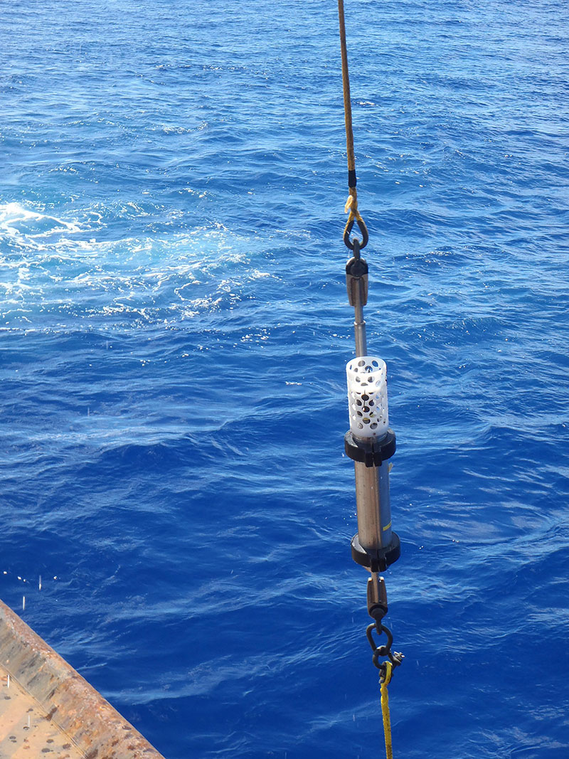 Deep-ocean hydrophone being brought back onboard the U.S. Coast Guard Cutter Sequoia after the deployment at Challenger Deep. The white top basket on top of pressure case protects hydrophone element