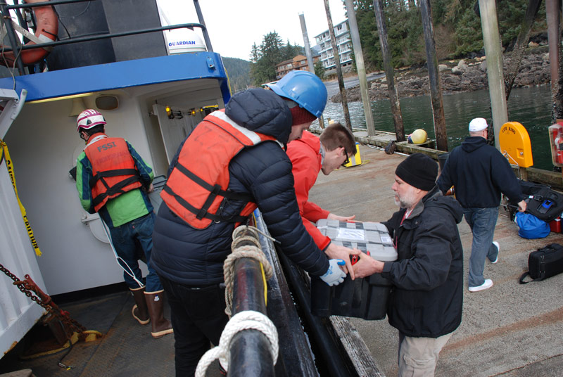 Members of the science team and ship's crew load all of the science gear onto the Norseman II.