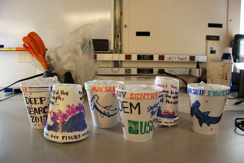 A few members of the DEEP SEARCH team participated in the time-honored oceanographic tradition of decorating, and then shrinking, Styrofoam cups. These cups can be sent down on any oceanographic equipment (i.e., CTD or AUV), where they will be exposed to the high-pressure environment and compress. It makes for both a fun lesson on depth/pressure and an excellent desktop souvenir.