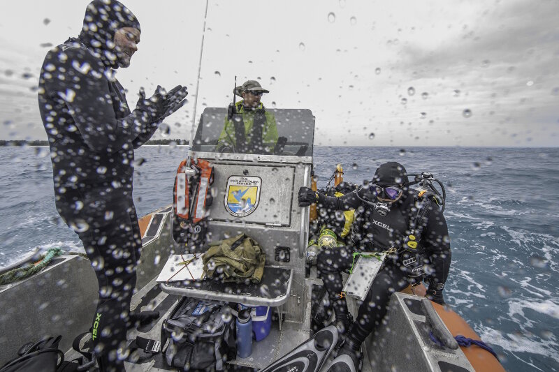 Fighting the wind and waves during daily dives on the anomaly boat with Brian, Russ, and Jason (left to right).