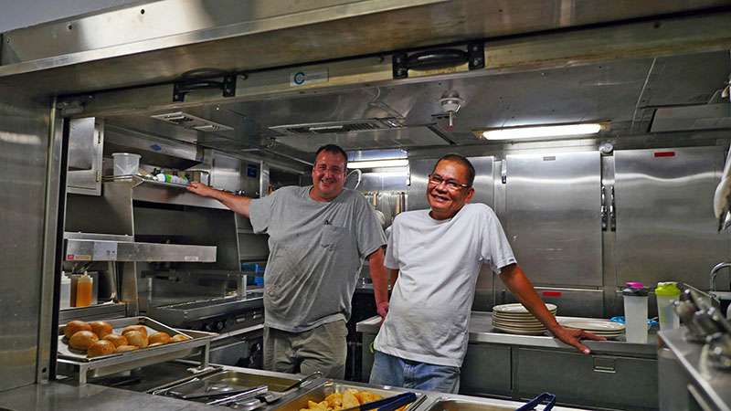 Left to right: 2nd Cook Bob Burroughs and CS Lito Llena in the ship’s galley.