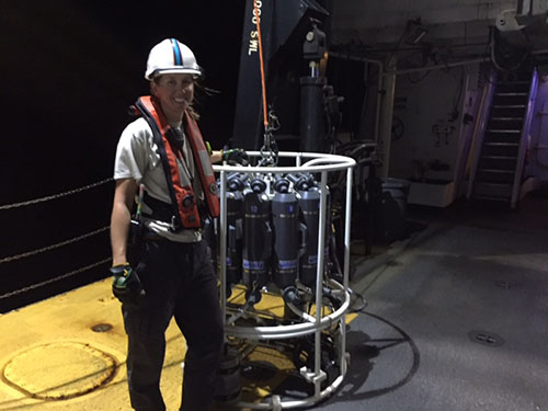 SST Samantha Martin with the ship’s CTD (conductivity, temperature, and depth sensing instrument) on the deck of NOAA Ship Nancy Foster.