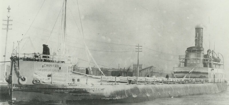 View from the port bow of Choctaw, shown here dockside amid cold weather. Ice has formed along the rigging and deck, though it’s characteristic ‘monitor’ style design is clearly seen with the small cabin over the bow and rounded sides defining the area surrounding the cargo hatches; date unknown.