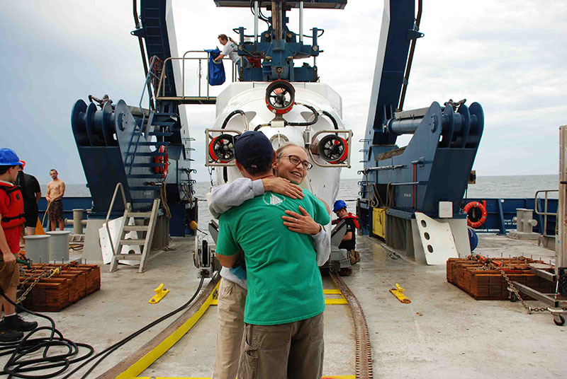 Mandy Joye and Erik Cordes hug after a successful Alvin dive to an active methane seep environment.
