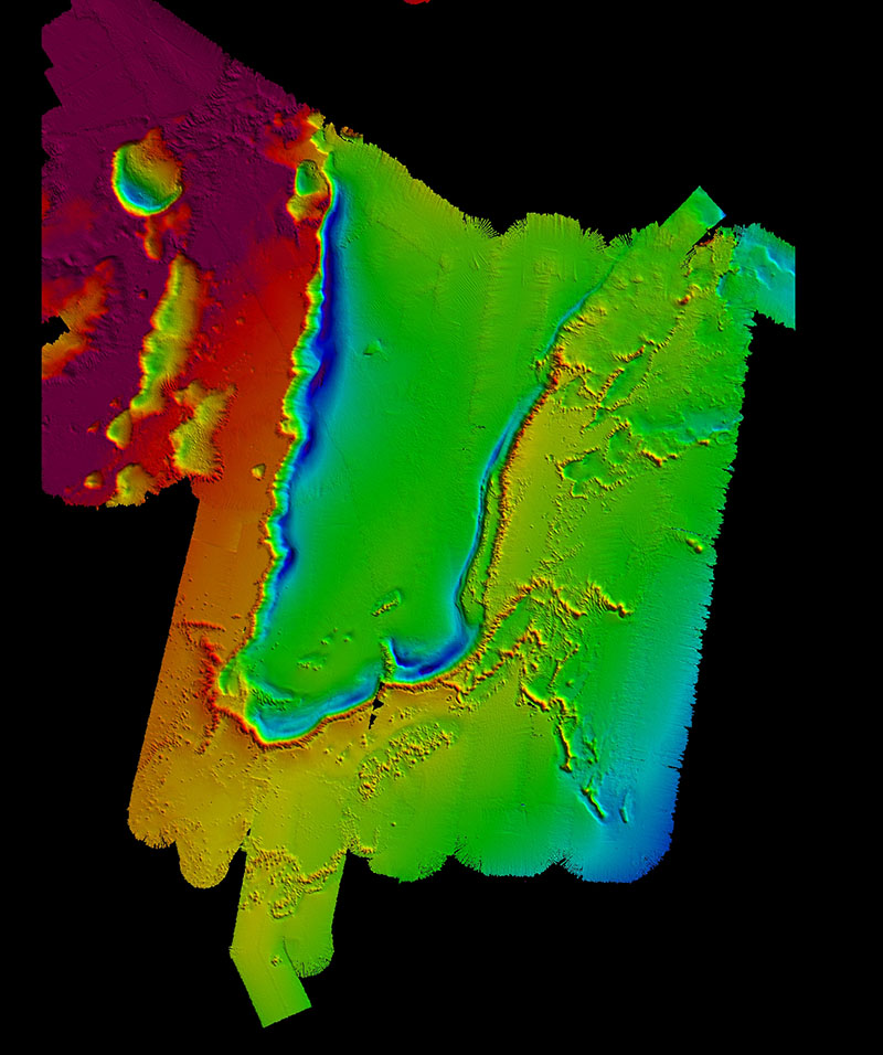 Map of the newly discovered reef complex off the coast of South Carolina. The linear reefs can be seen on the right of the image as a series of mounds and ridges in red and yellow against the green and blue background. The total length of all of the linear features is approximately 85 miles. Bathymetry data collected by NOAA Ship Okeanos Explorer Windows to the Deep 2018 expedition and R/V Atlantis AT-41, and map created by Meme Lobecker and Jason Chaytor.