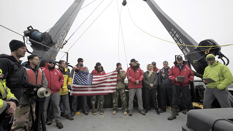 The project team and members of the crew of the R/V Norseman II conduct a wreath ceremony to honor the final resting place of the 71 Sailors lost on the USS Abner Read.