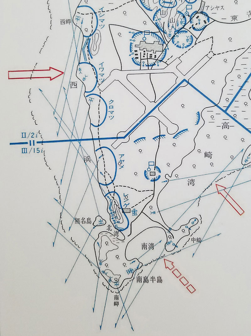Section of an August 1945 Japanese defensive plan. The red arrows are the presumed U.S. avenues of approach for the invasion. The blue arrows represent the fields of fire of the gun emplacements across the invasion beaches and reef. The blue half-circles on the beaches represent general defensive positions. 