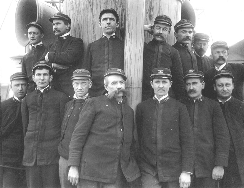 Bear officers, including Second Lt. Ellsworth Bertholf (front row far left), First Lt. David Jarvis (front row third from left), Captain Francis Tuttle (center), and U.S. Public Health Service Surgeon Samuel J. Call (back row far right). 