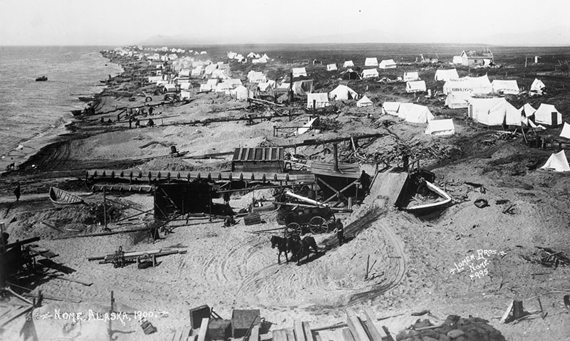 A 1900 photograph of Nome, Alaska, showing tents and mining equipment during the local gold rush.