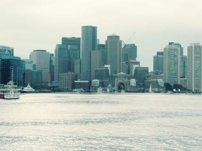 The Boston skyline passes by as U.S. Coast Guard Cutter <em>Bear</em> heads to the North Atlantic.