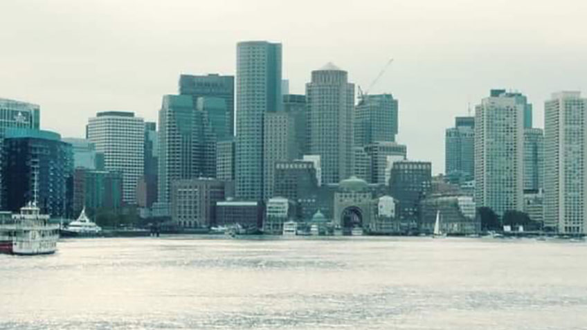 The Boston skyline passes by as U.S. Coast Guard Cutter <em>Bear</em> heads to the North Atlantic.