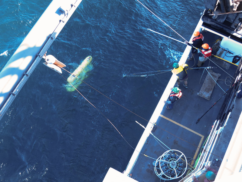 Fig. 3. AUV Popoki being recovered to the ship after completing a dive.