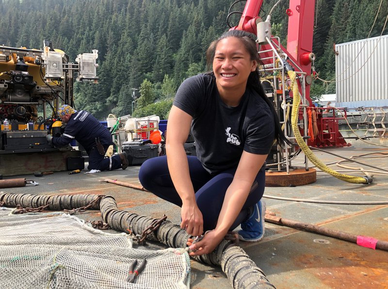 Kate Ariola is learning how to “mouth a shackle” on the fishing net.