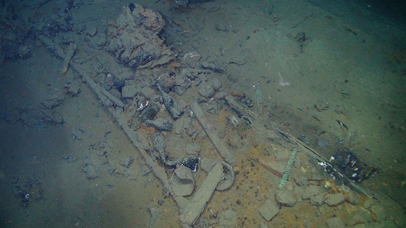 Artifacts found at Site 15470 at ~1,800 meters (~5,905 feet) depth.