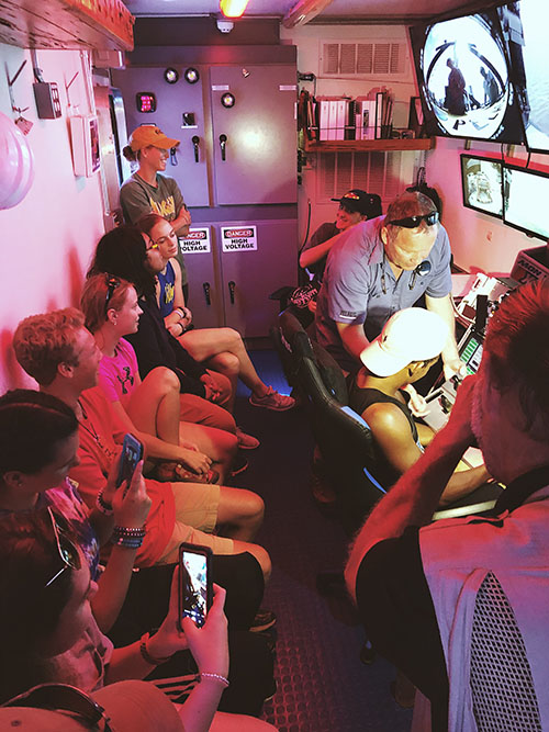 Students in the control room learning what it takes to pilot the ROV Odysseus during multimillion-dollar missions.