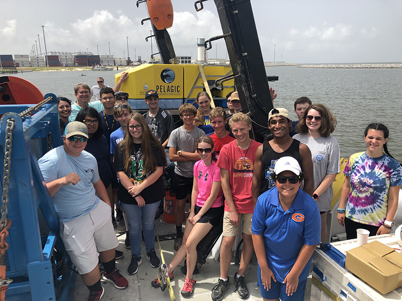 Ocean Science and Technology students aboard the R/V Point Sur, next to Pelagic Research Services ROV Odysseus.
