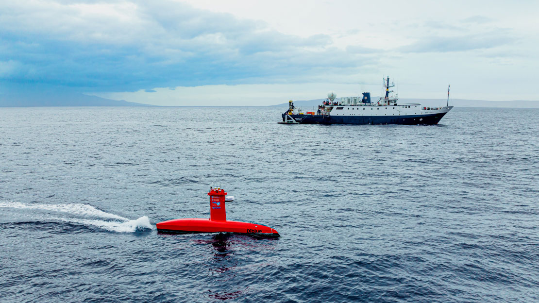 Exploration Vessel Nautilus and uncrewed surface vehicle DriX, which will be used to map the seafloor of Iron Bottom Sound during the Maritime Archaeology of Guadalcanal expedition.