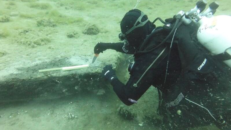 One important find made already as part of the Discovering the Submerged Prehistory of the Alpena-Amberley Ridge in Central Lake Huron expedition is an extensive deposit of preserved peat along the Alpena-Amberley Ridge. Diver Tyler Schultz collects a sample of the peat.