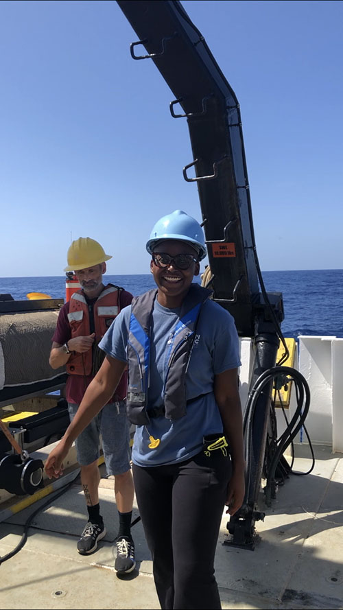 Darrielle Williams on the deck of Research Vessel Point Sur during the August 2021 expedition to search for SS Norlindo. Darrielle was an intern in the Tuskegee University Ocean Exploration Internship Program and joined the team during the first leg of the search. She is one of seven students spanning interns and undergraduate and graduate students participating in the expedition and learning about advances in ocean science, engineering and technology advancements to help prepare the future exploration workforce.