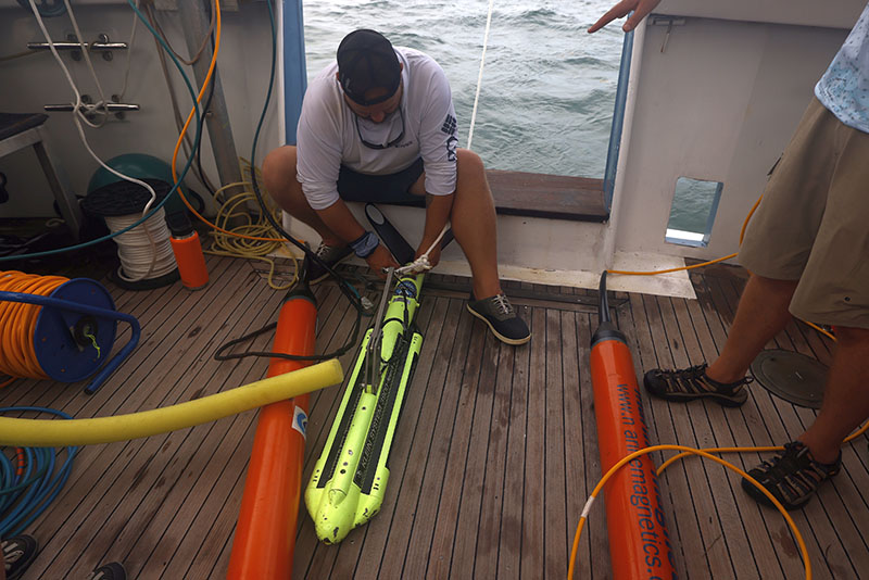 University of Miami student Ryan Fochs prepares the remote sensing equipment for launch during the Florida Keys National Marine Sanctuary Quicksands Archaeological Survey expedition.